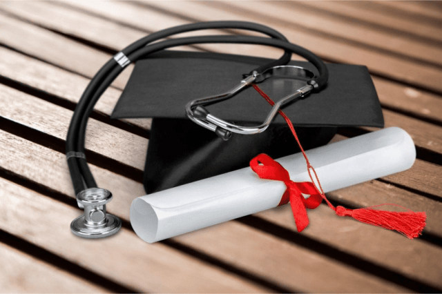 A graduation cap and diploma with a stethoscope  Description automatically generated